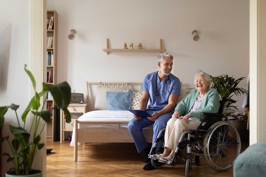 Older adult using a walker enters an accessible assisted living van with staff assistance.